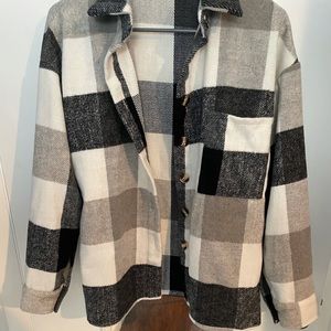 Women’s black/white/grey plaid flannel long sleeve button down.